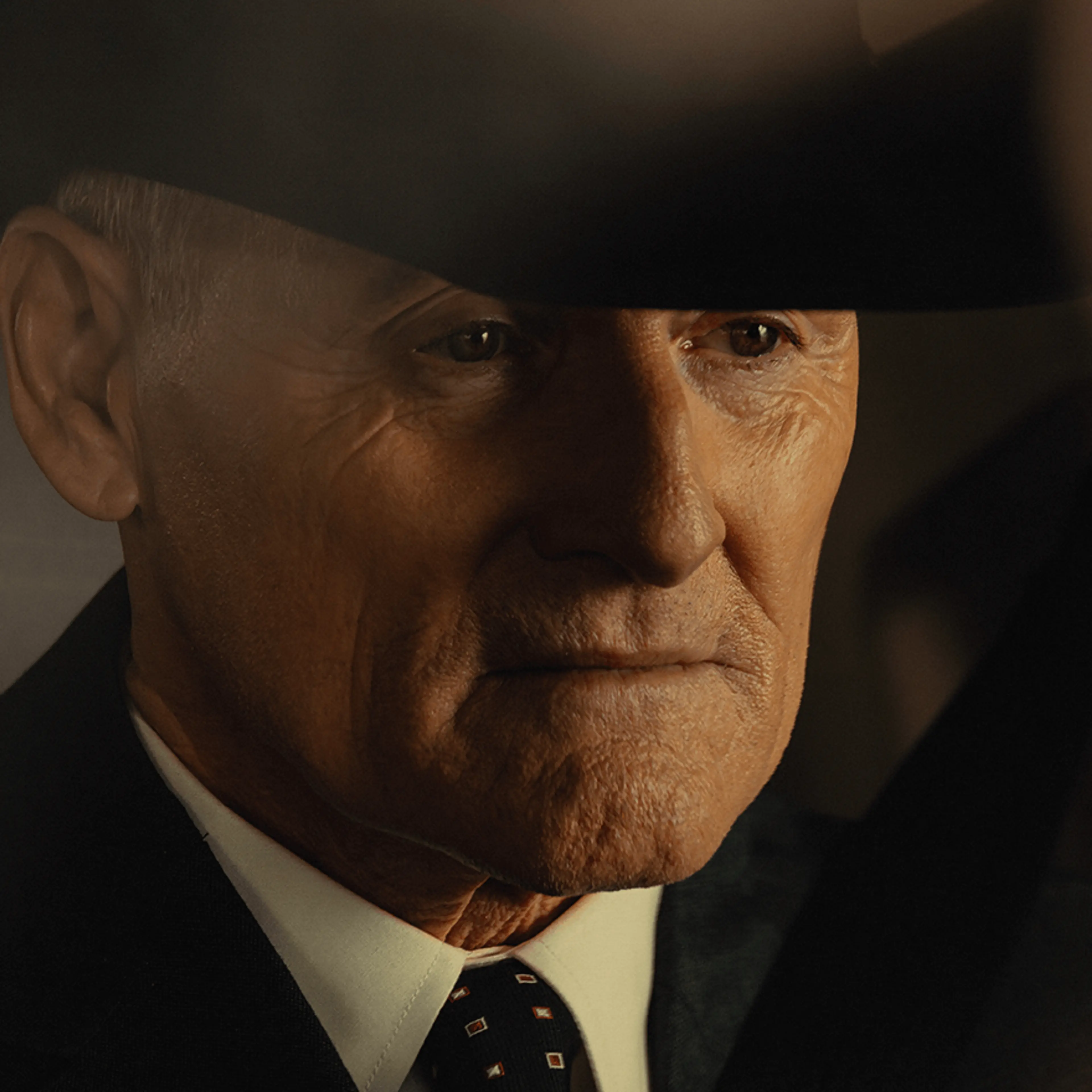 Colm Feore as Nathan, wearing a black hat in Landman.