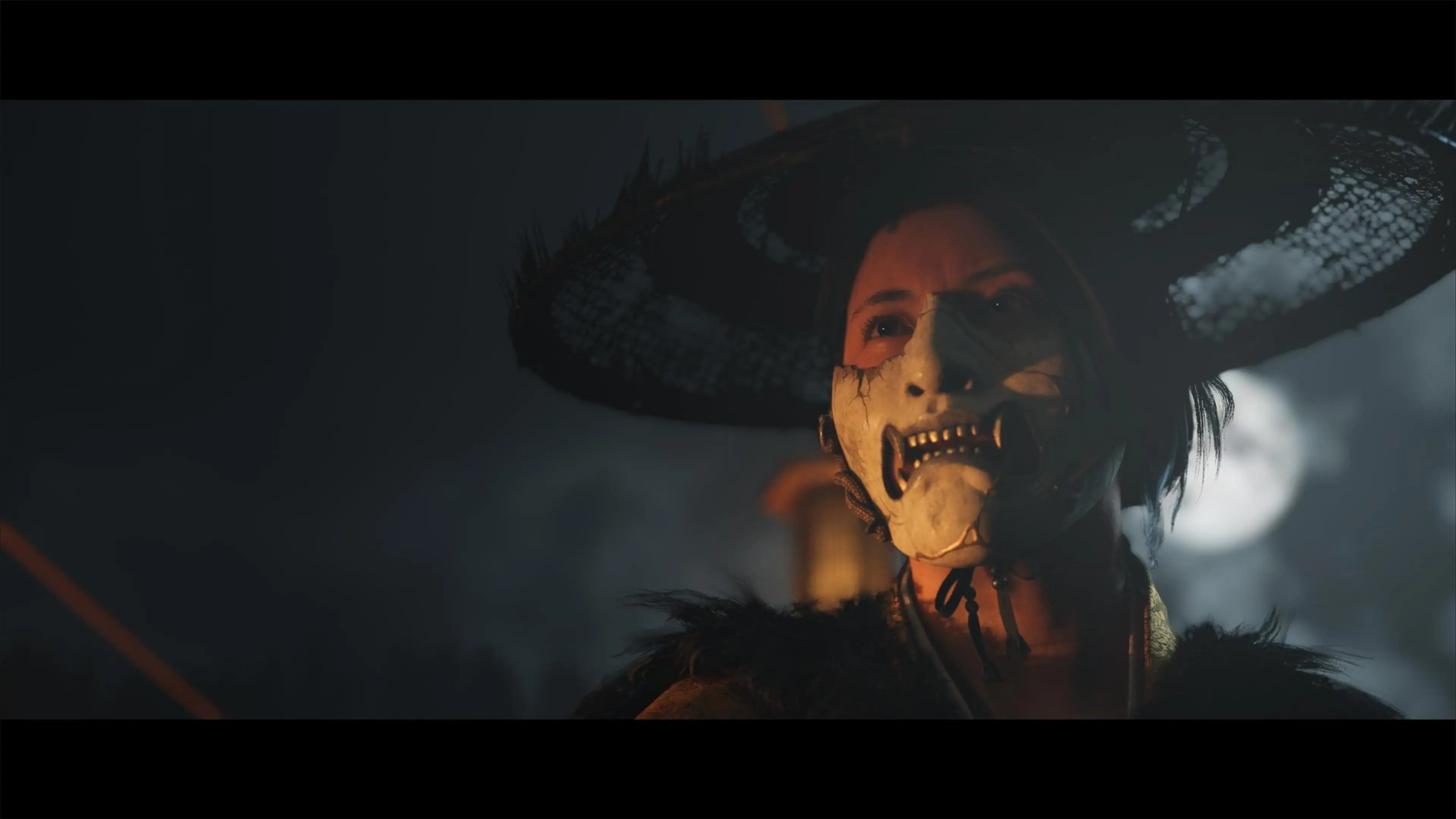 Atsu wears a weathered hat and a skull-like mask in Ghost of Yōtei.