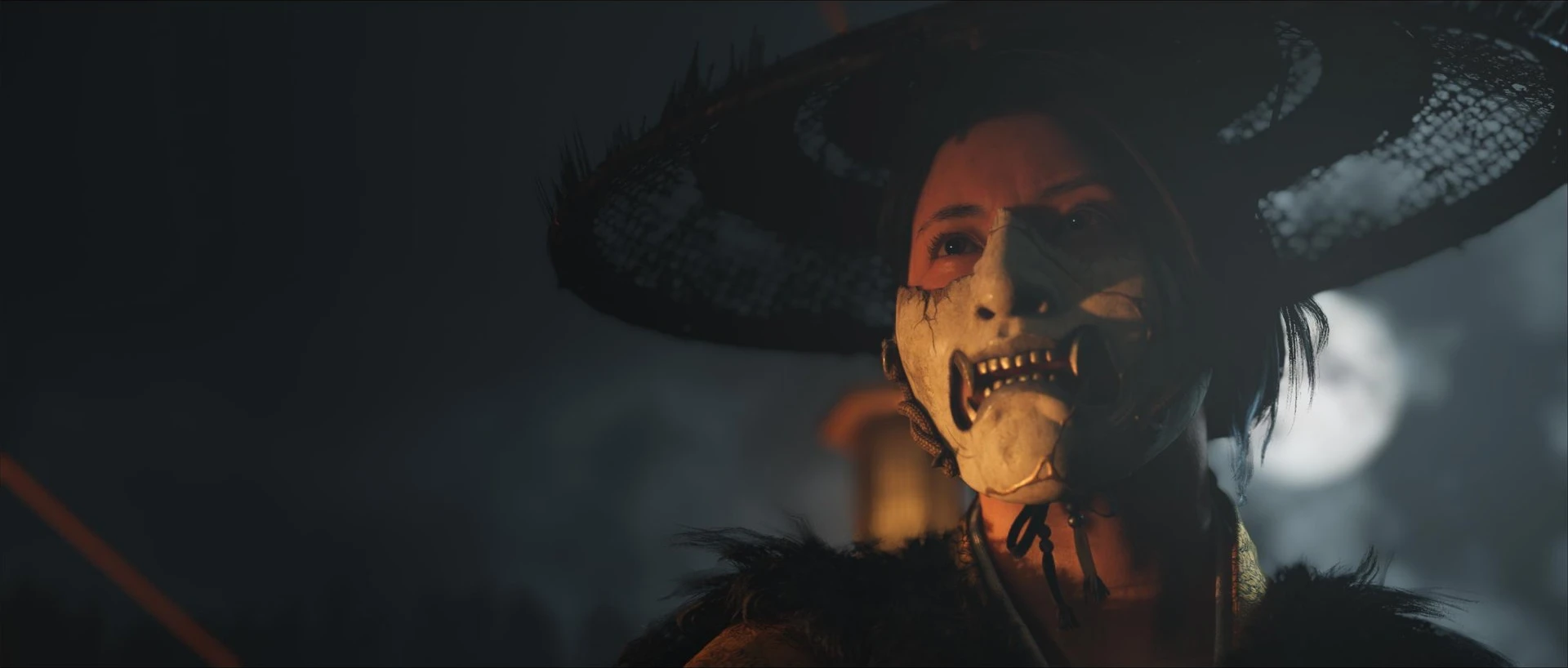 Atsu wears a weathered hat and a skull-like mask in Ghost of Yōtei.