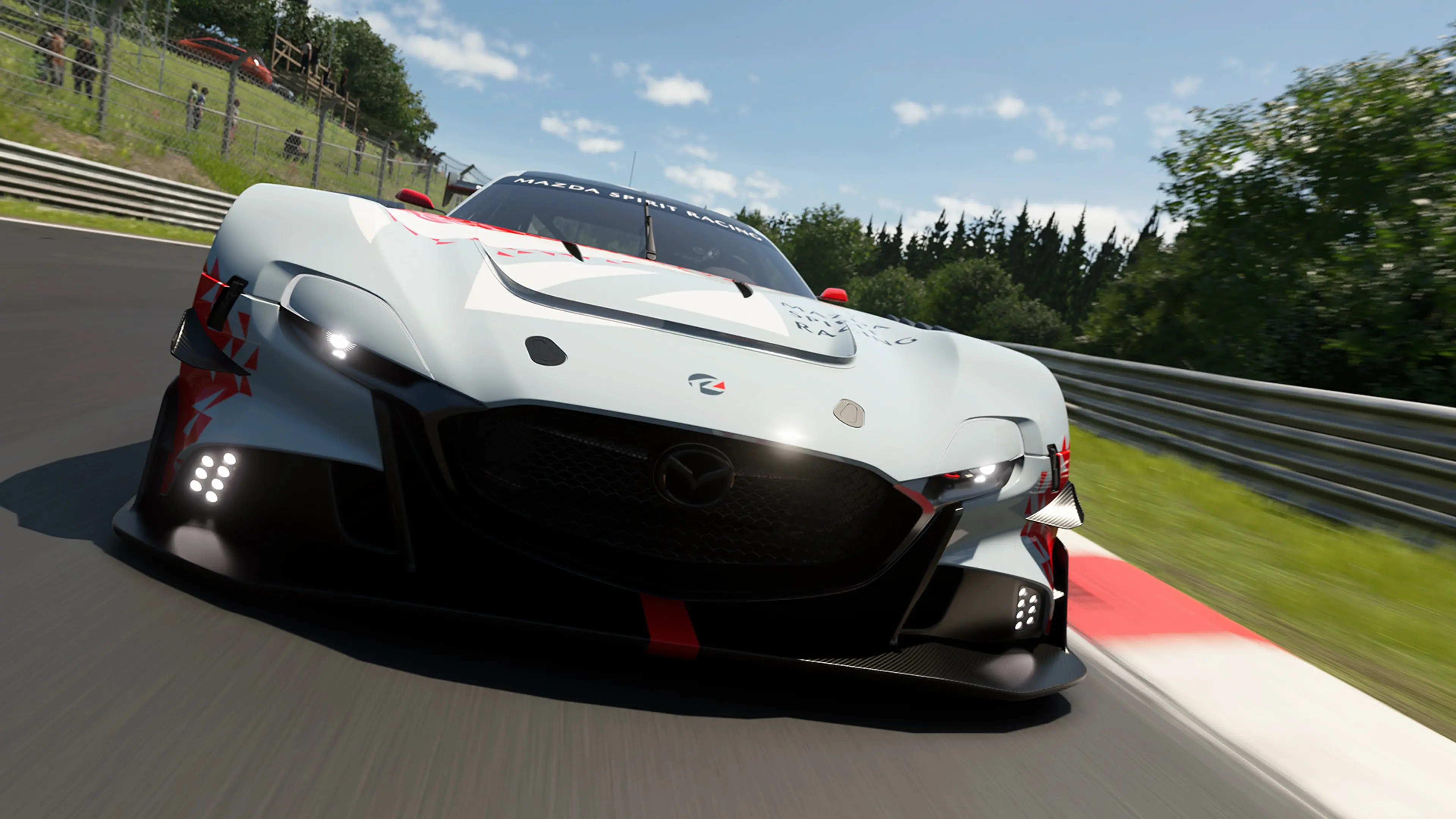 A white race car corners at speed in Gran Turismo 7 Spec IV.
