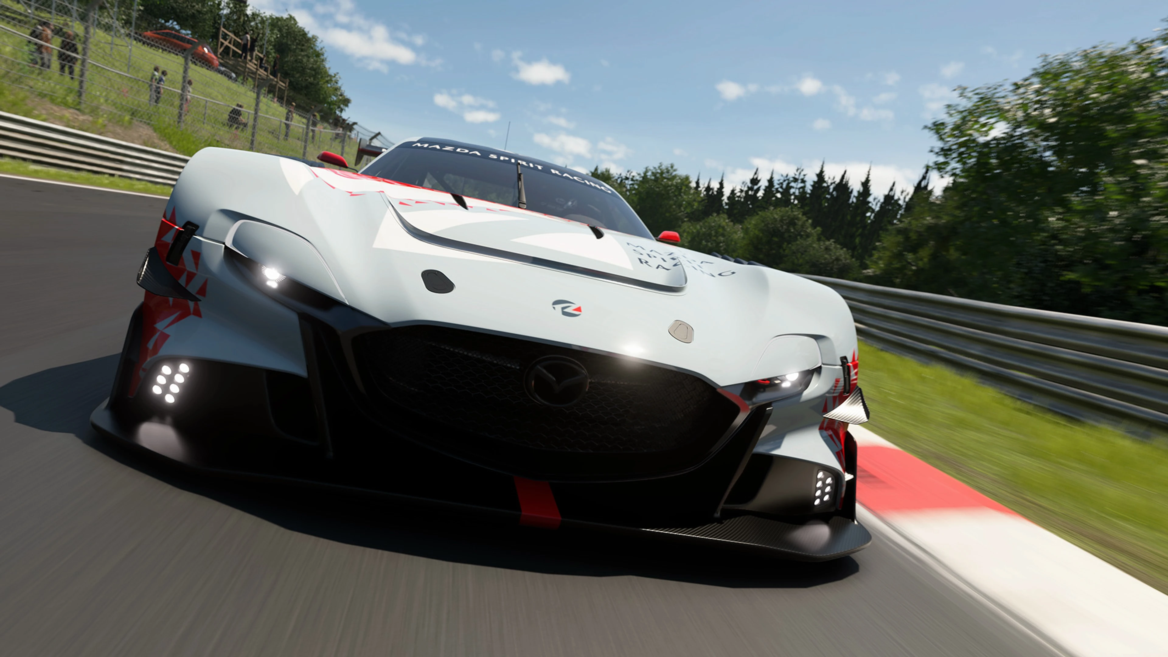 A white race car corners at speed in Gran Turismo 7 Spec IV.