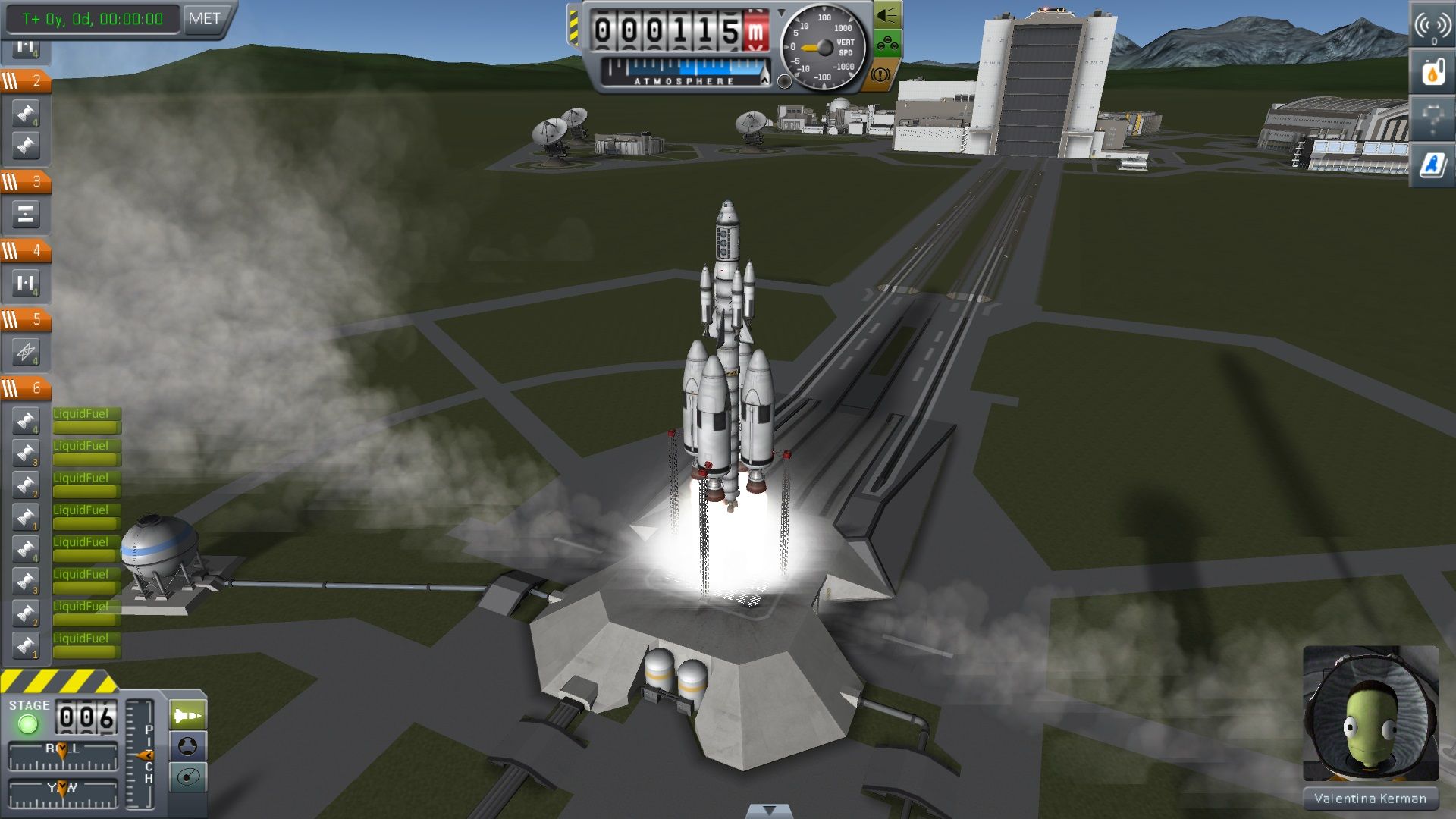 A rocket rises from the launchpad with the space center below and a flight display around the screen.