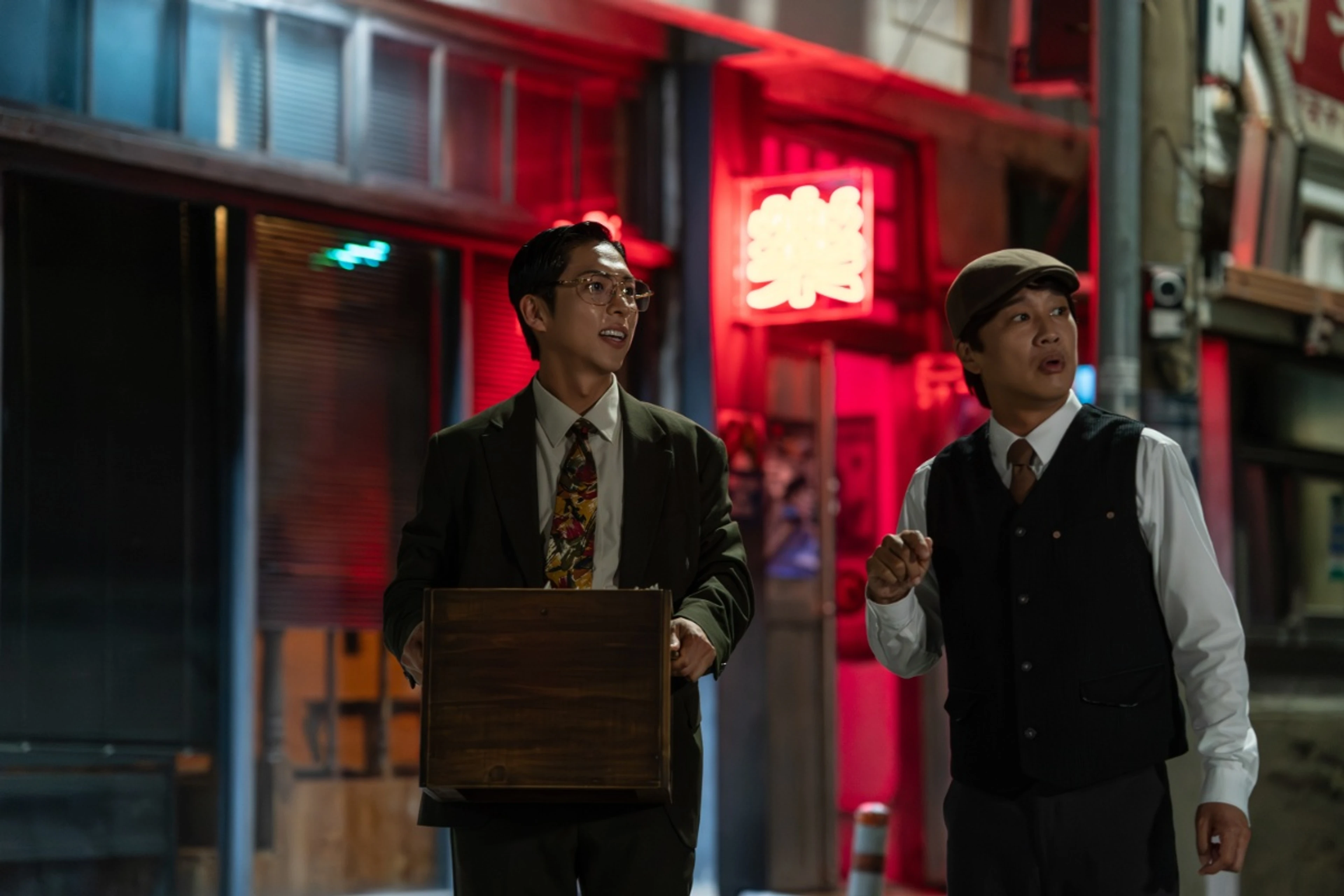 Joo Jong-hyuk and Cha Tae-hyun stand on a nighttime street in Your Personal Taxi.
