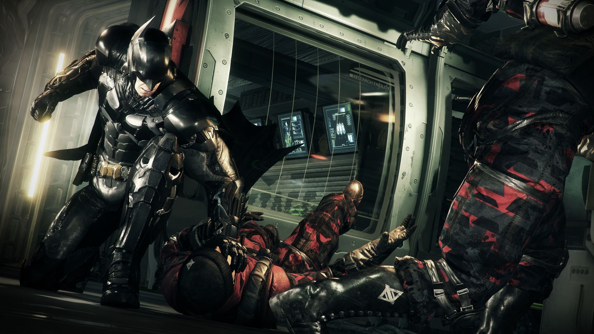 Batman fights several armed opponents inside a bright room.