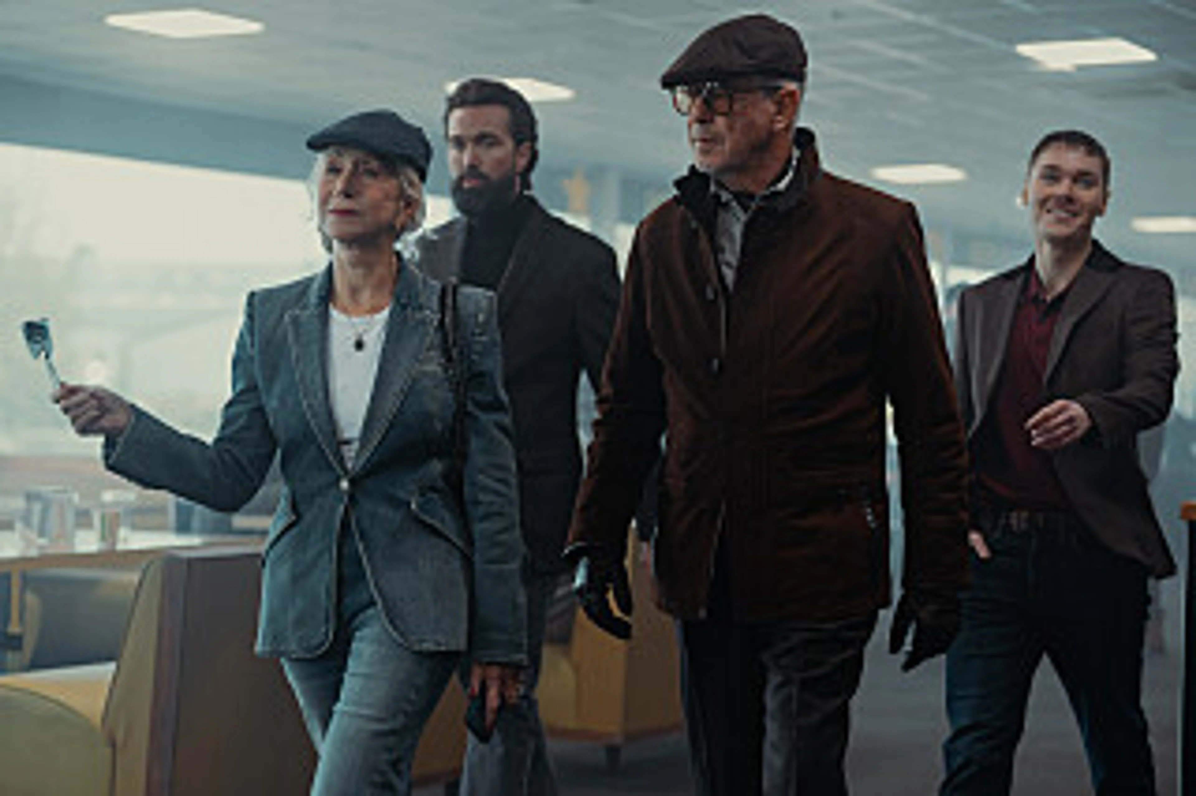 The MobLand ensemble walks through a bright interior in an official Season 2 still.