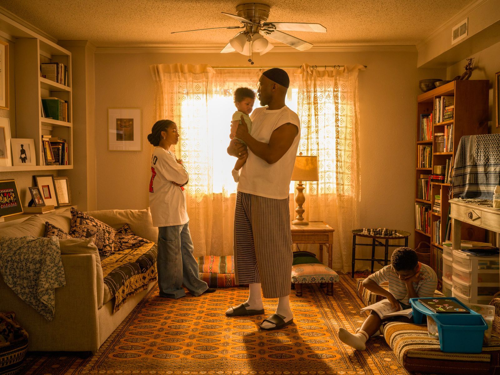 Mahershala Ali as Latif holds his infant child.