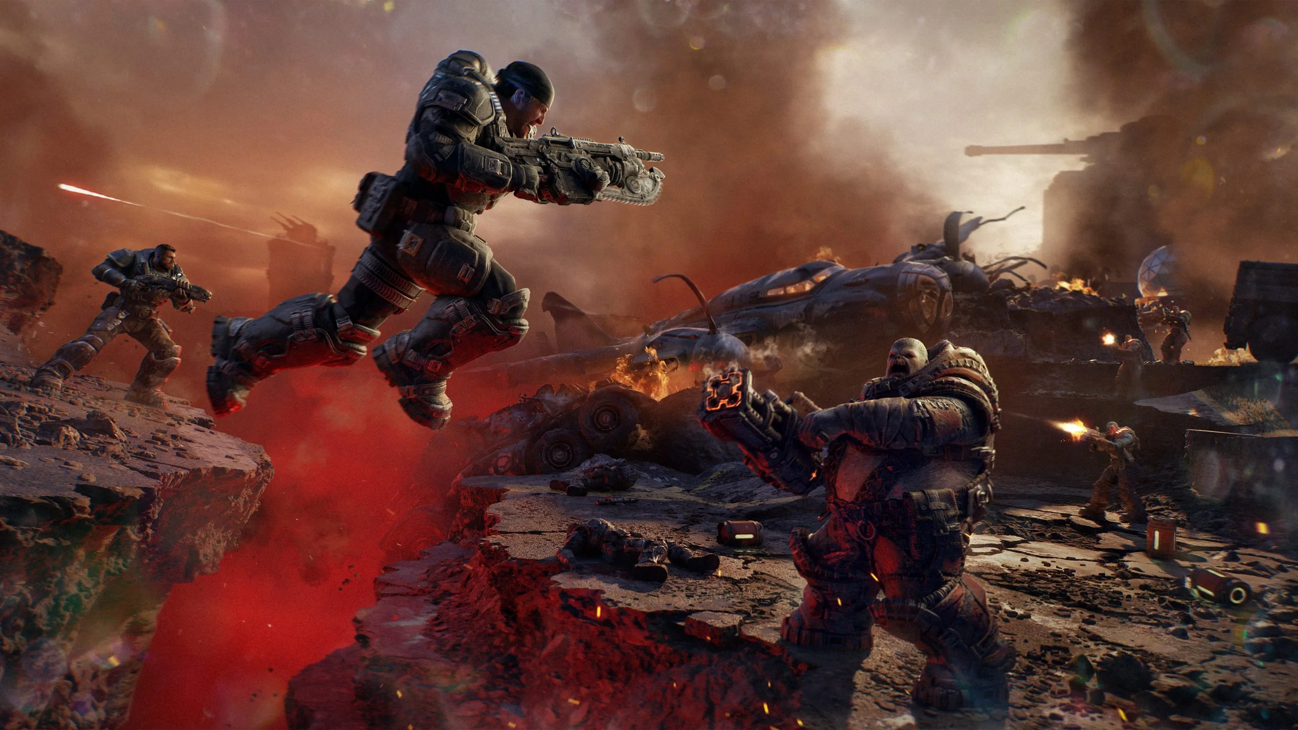 Marcus jumps across a gap with his rifle raised above a Locust below him.