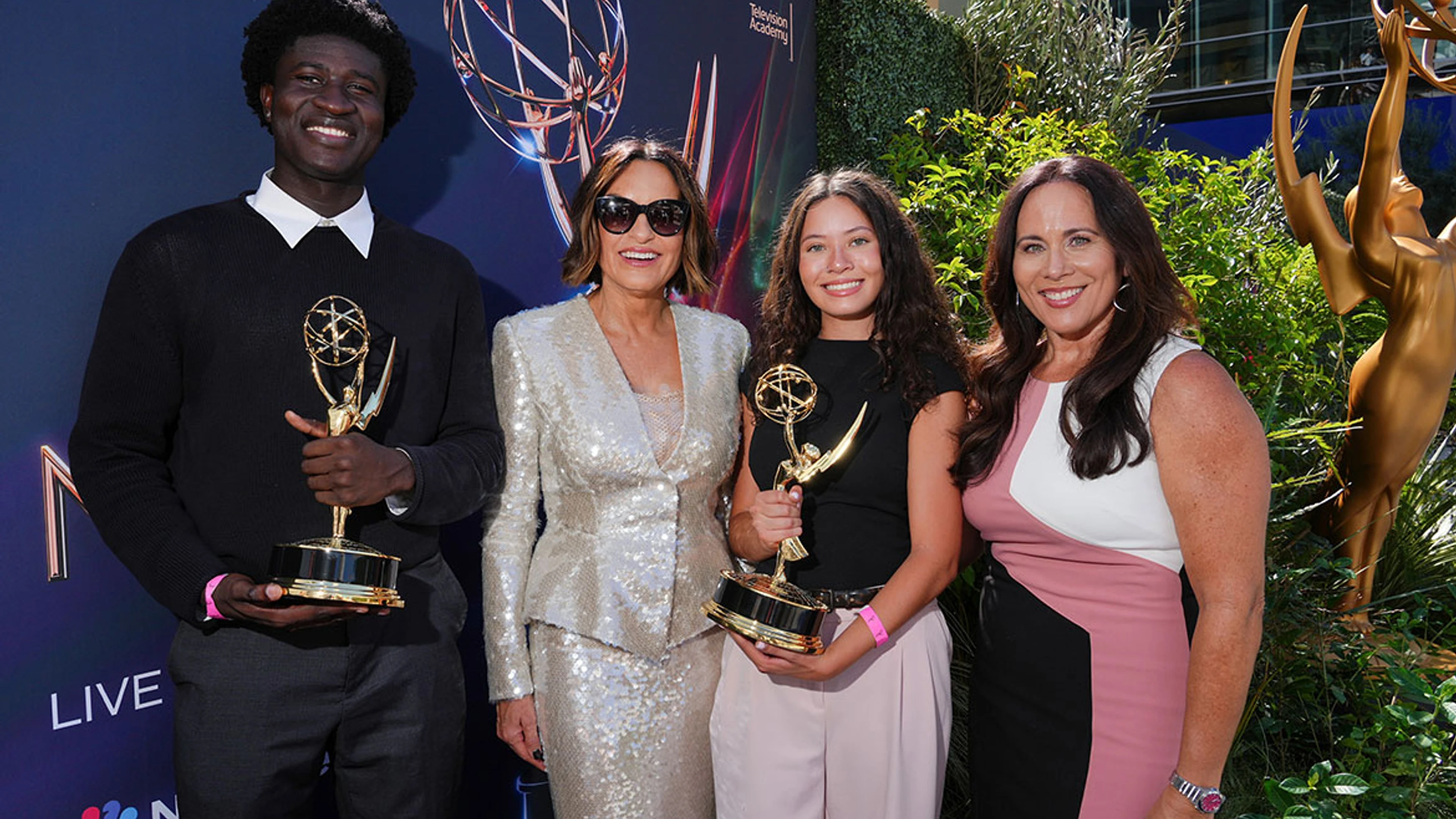 Mariska Hargitay stands with David Diouf, Marissa Morales, and Anne Vasquez as they hold Emmy statuettes at the 78th Emmy Awards press preview.