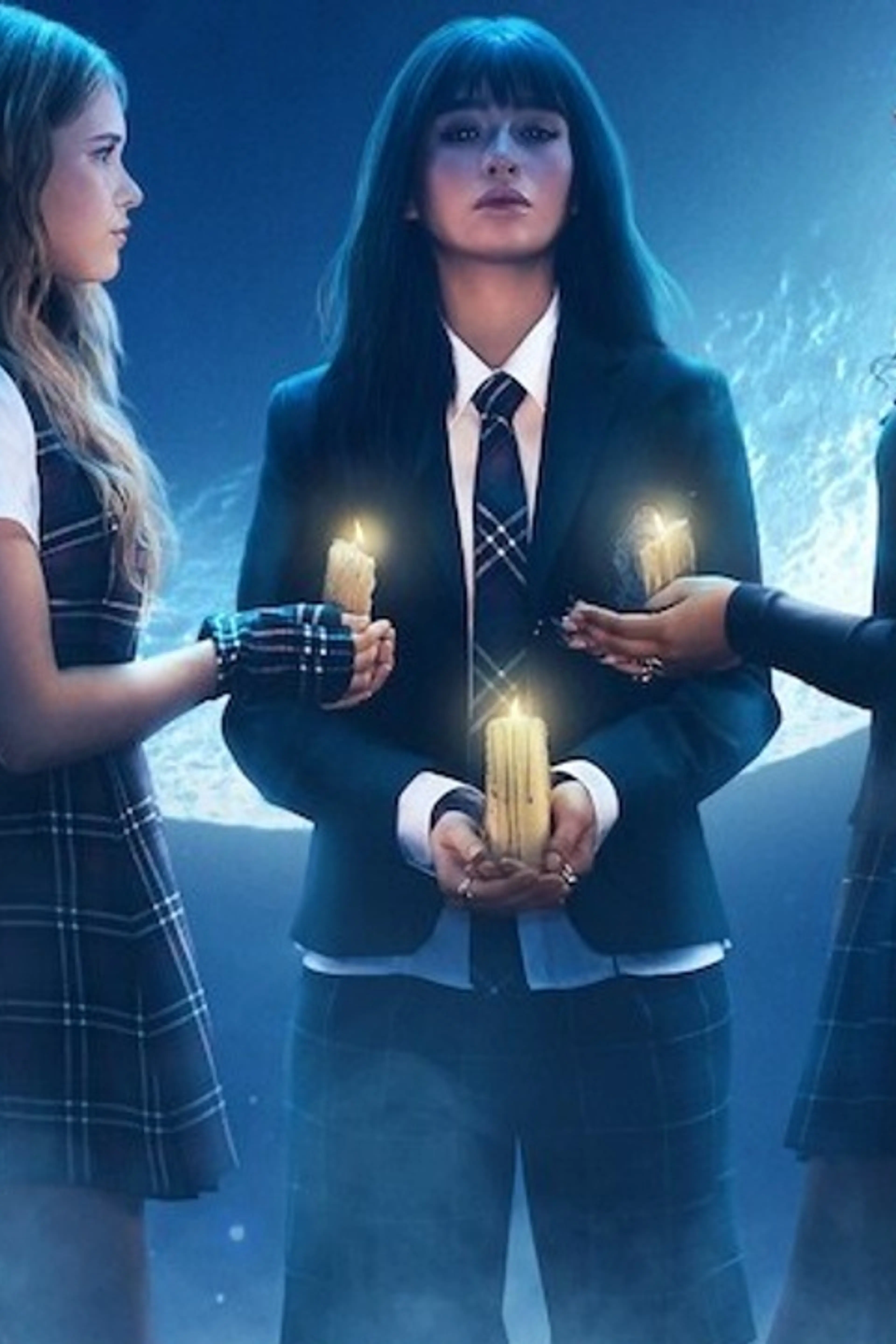 Three teenage witches hold candles beneath a large moon in official Coven Academy artwork.