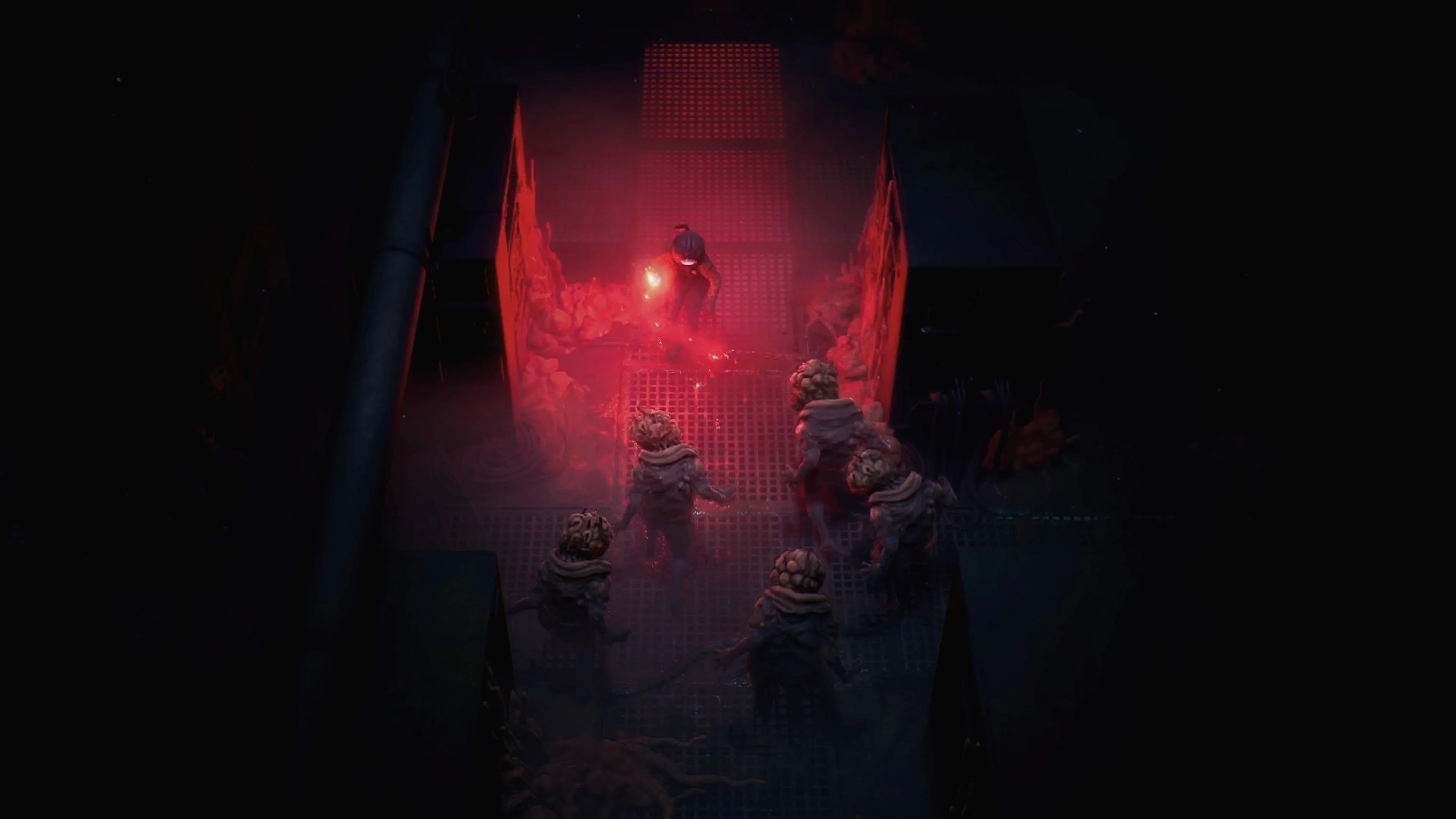 Cel fights several pale creatures under red lights in the underground facility.