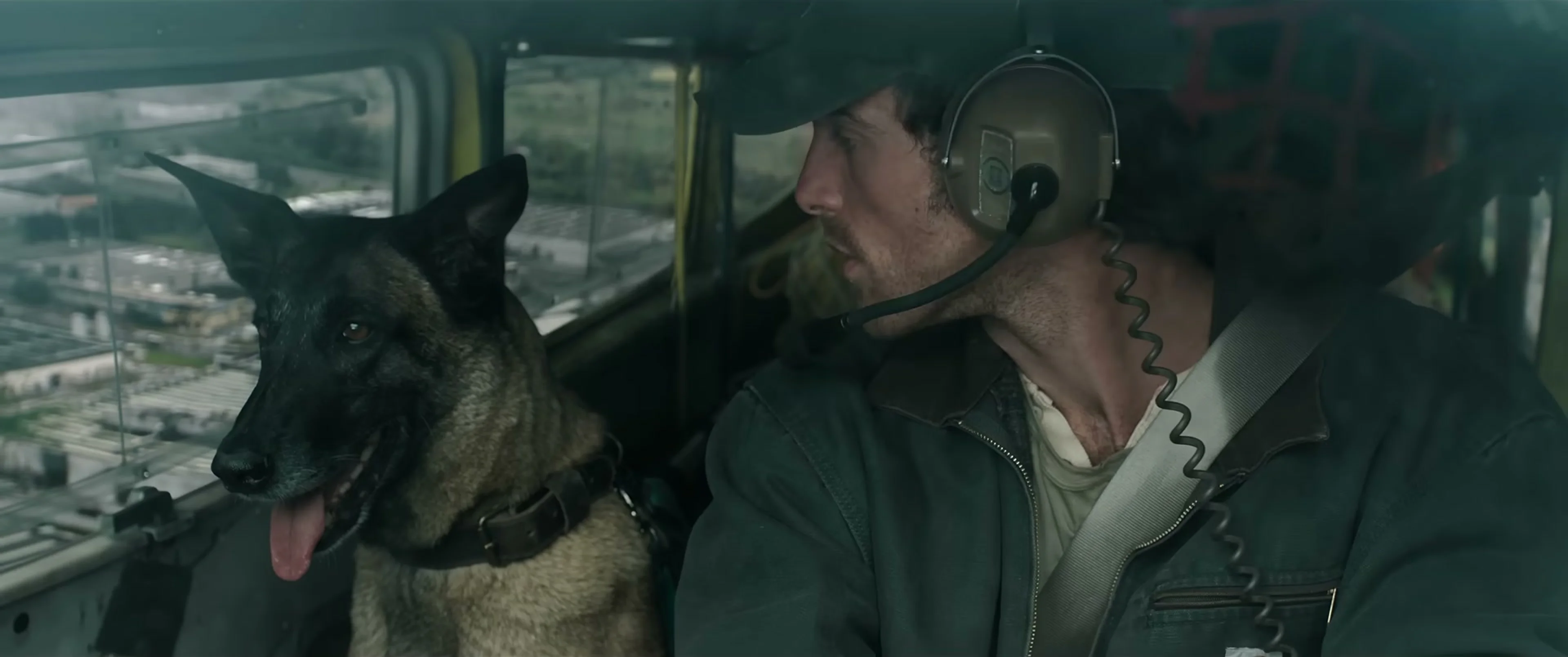 Hig and Jasper sit together inside the Cessna cockpit in The Dog Stars.