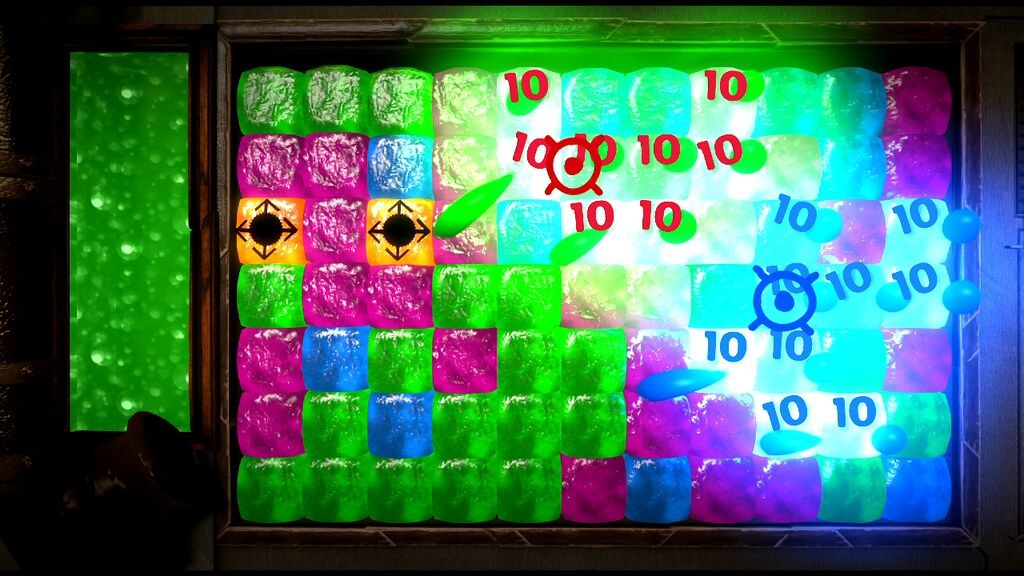 Brightly coloured square tiles with score numbers in a LittleBigPlanet 2 Move Pack minigame preview.