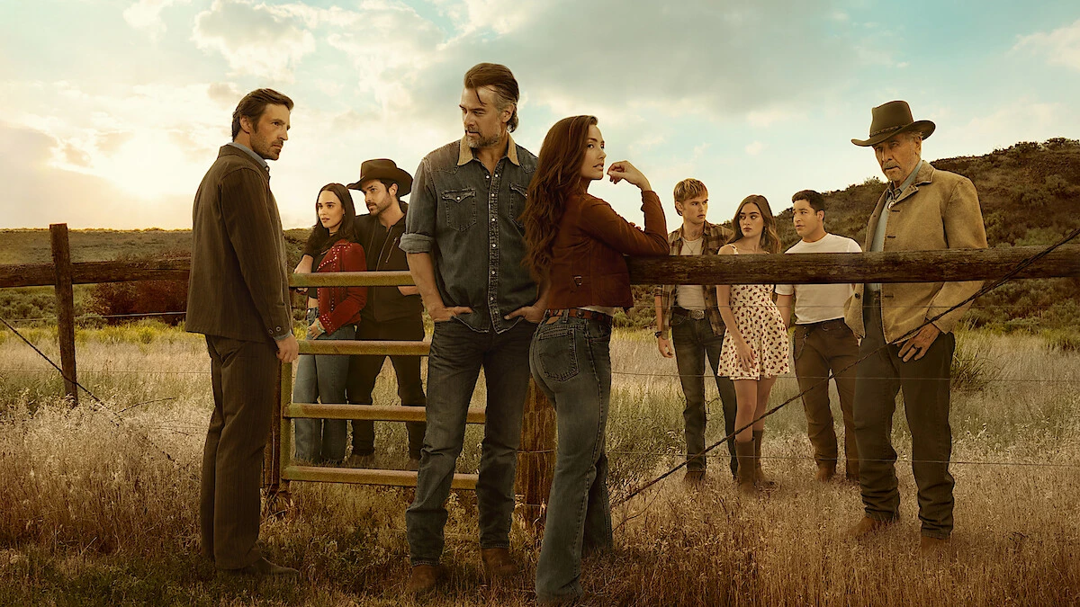 Josh Duhamel and Minka Kelly stand with the Ransom Canyon Season 2 cast on a Texas ranch.
