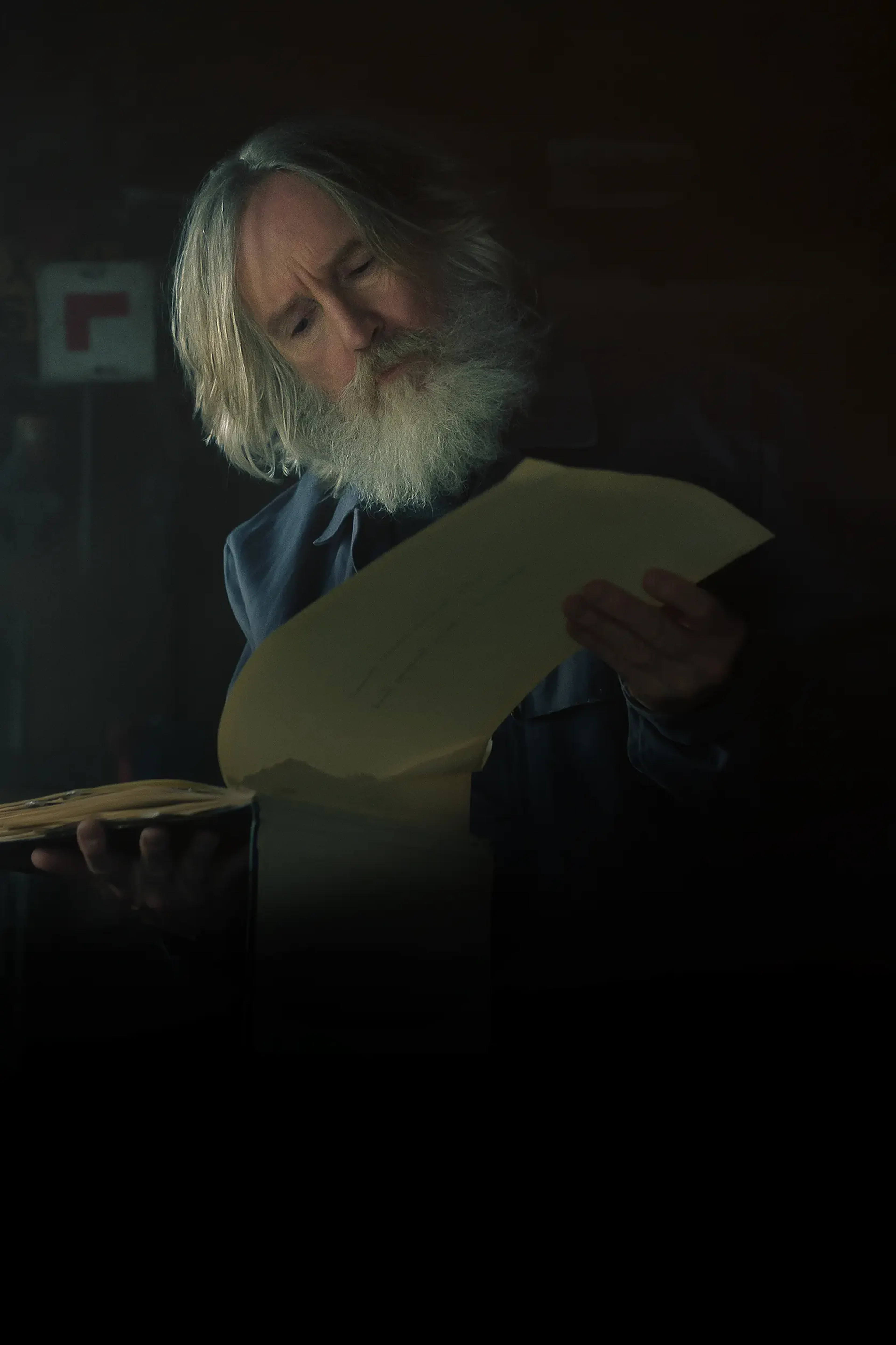Michael Sleep reads an old journal in the Small Prophets Apple TV cover.