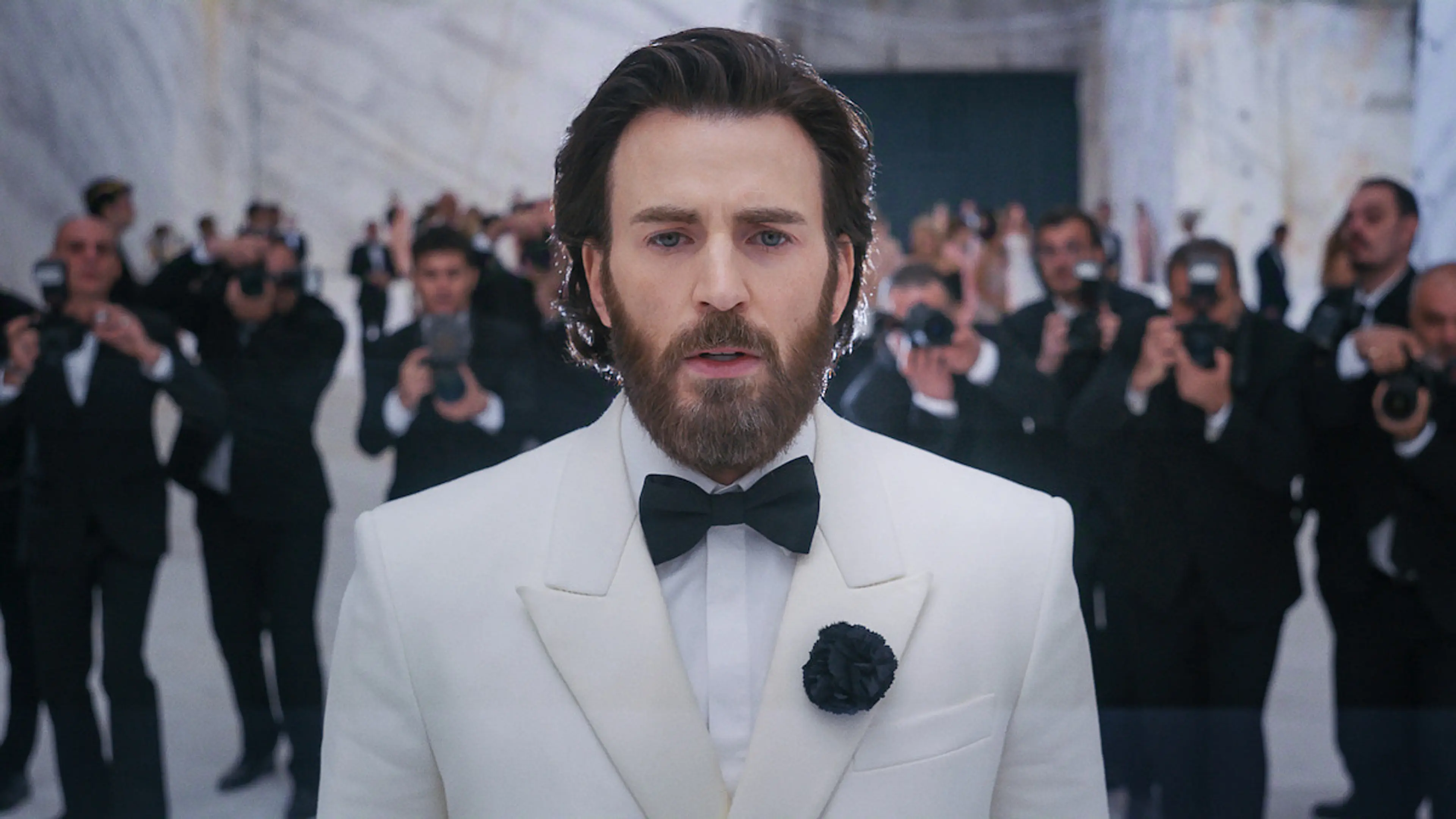 Chris Evans as Mike Tyler attends a glamorous gala in Sacrifice.