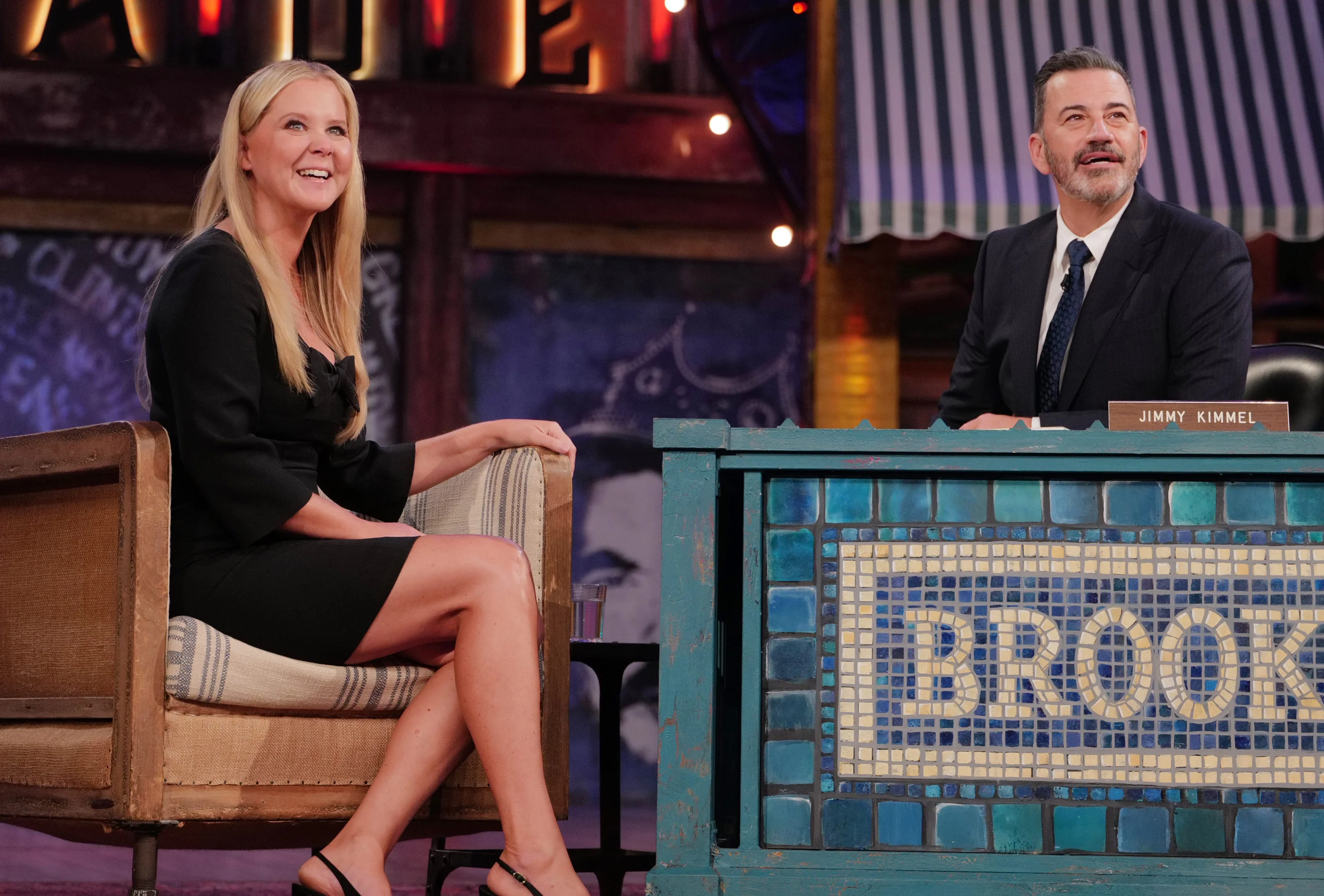 Amy Schumer and Jimmy Kimmel look upward during their Brooklyn interview.