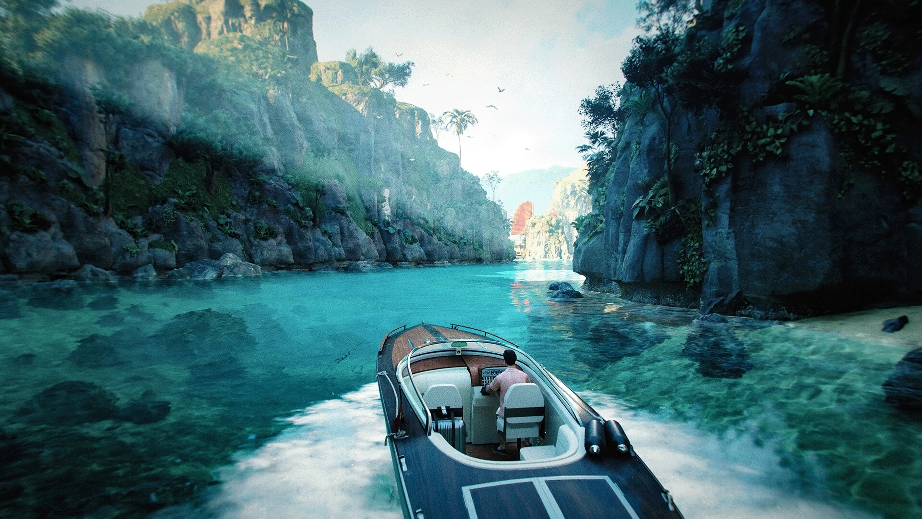 Bond’s speedboat travels across blue water between tall rocky cliffs.