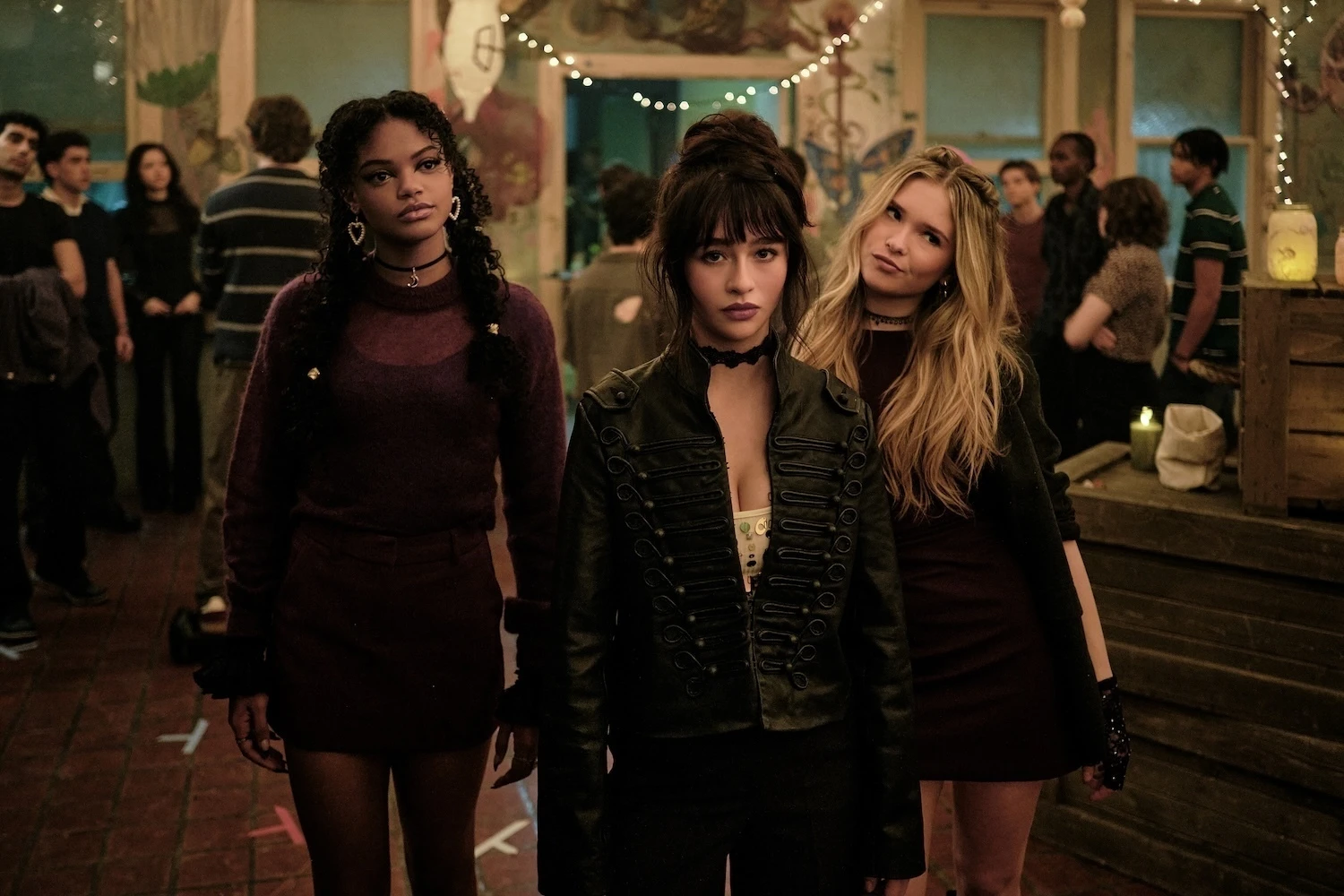 Three students stand together at Coven Academy.