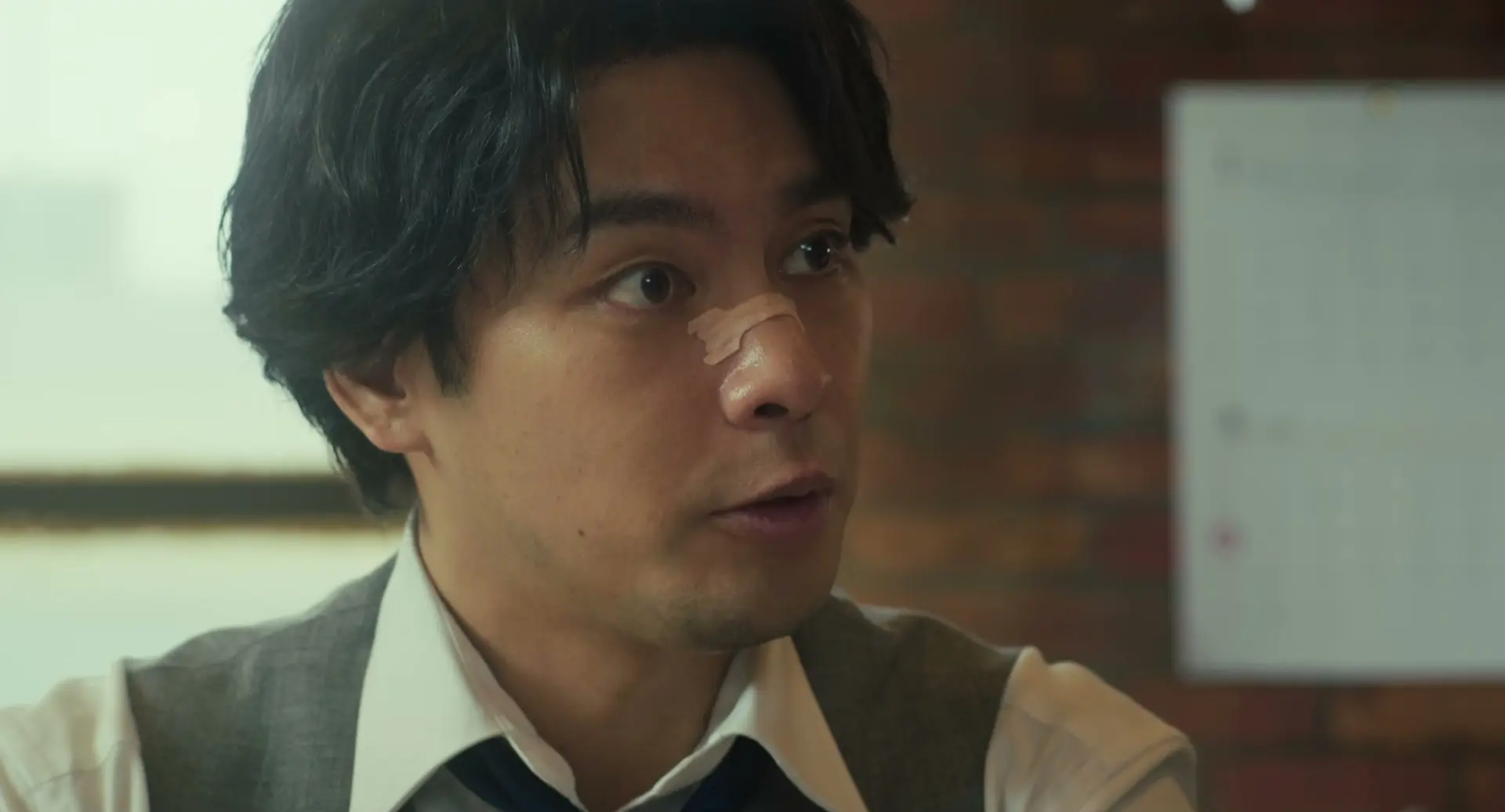 Yuya Yagira as lawyer Taiza Kujo looks to the side in the new Sins of Kujo movie teaser.