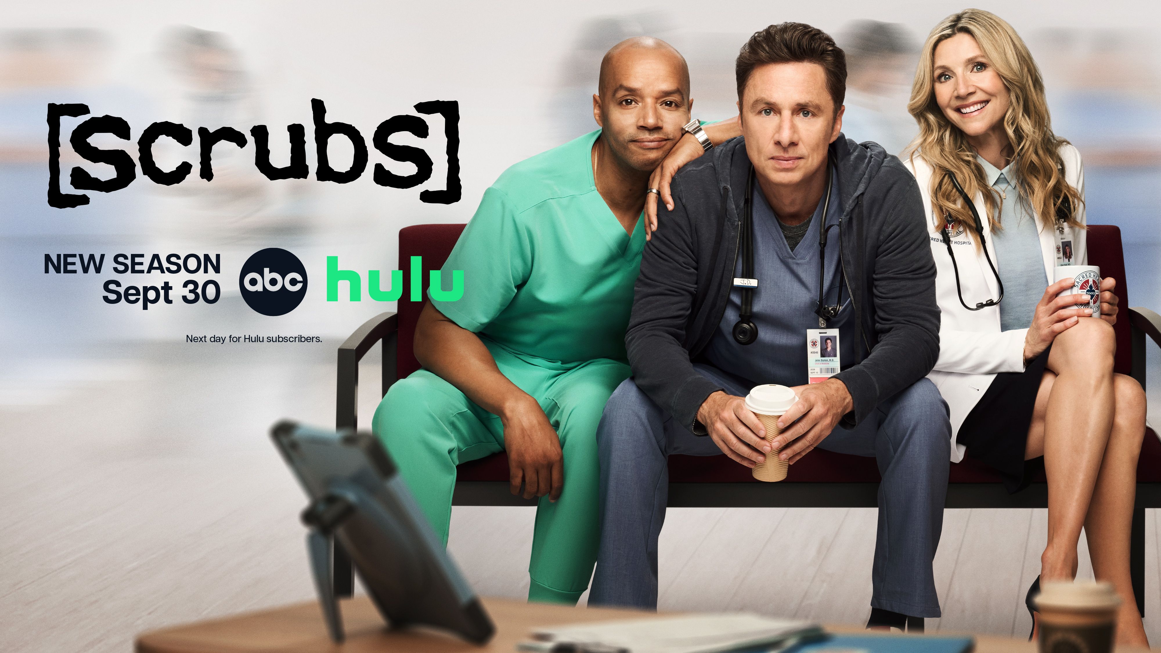Zach Braff, Donald Faison and Sarah Chalke sit together in Scrubs Season 2 key art.