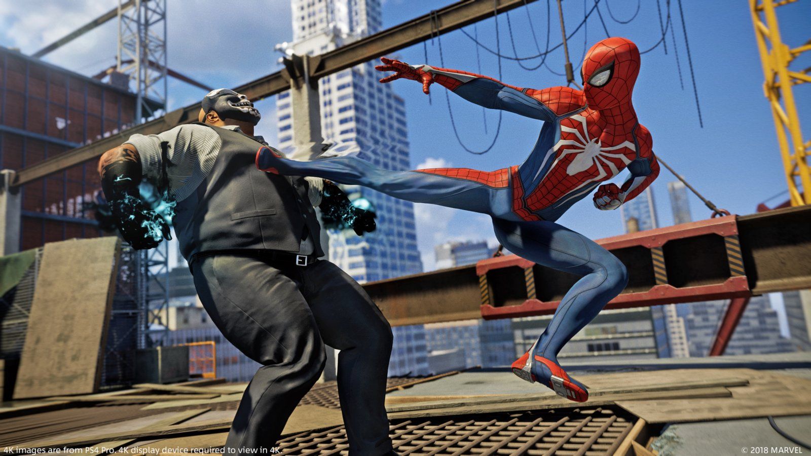 Spider-Man kicks an armed opponent on a rooftop platform.