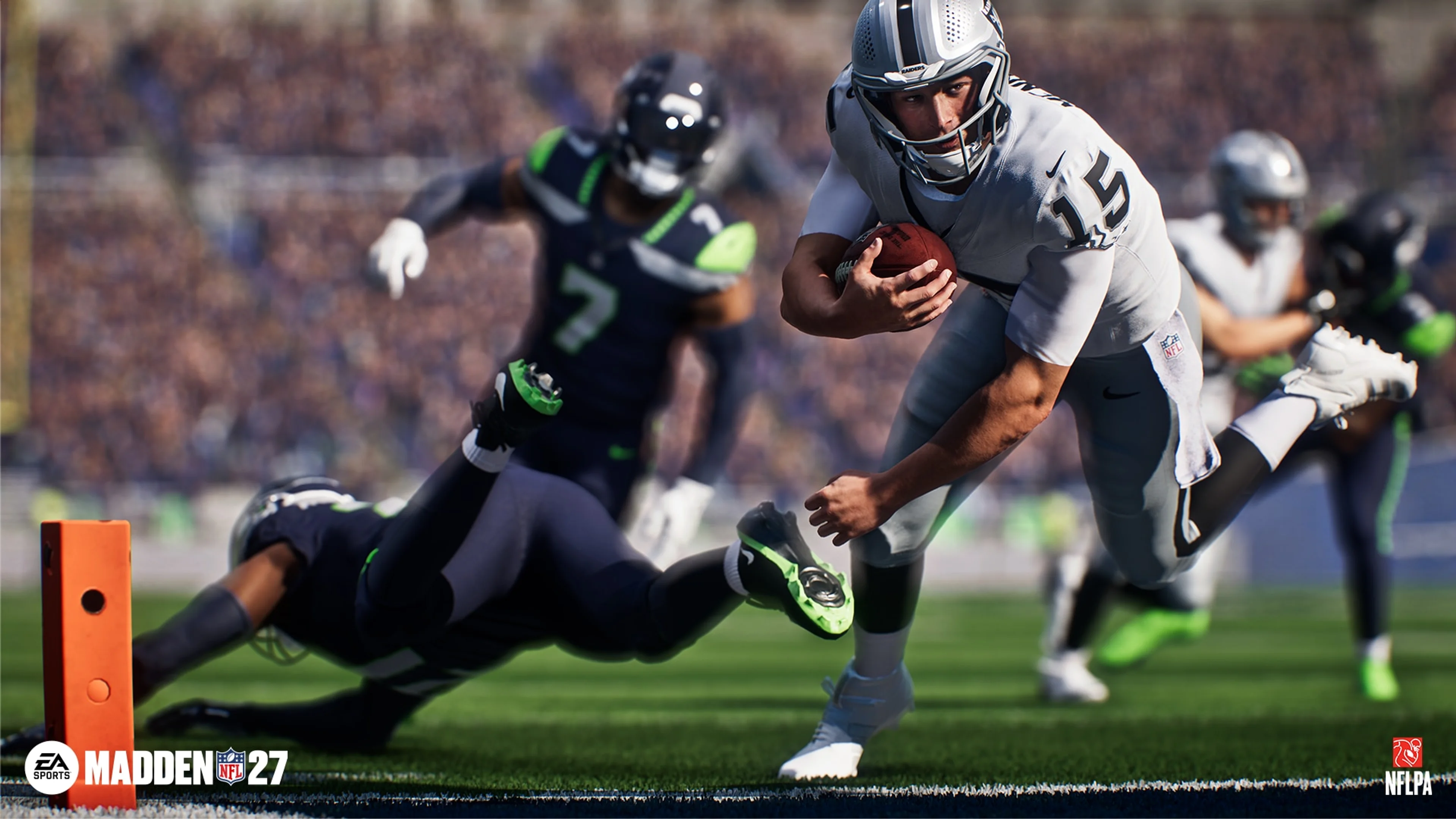 A Las Vegas Raiders ball carrier dives toward the end zone against Seattle defenders in Madden NFL 27.