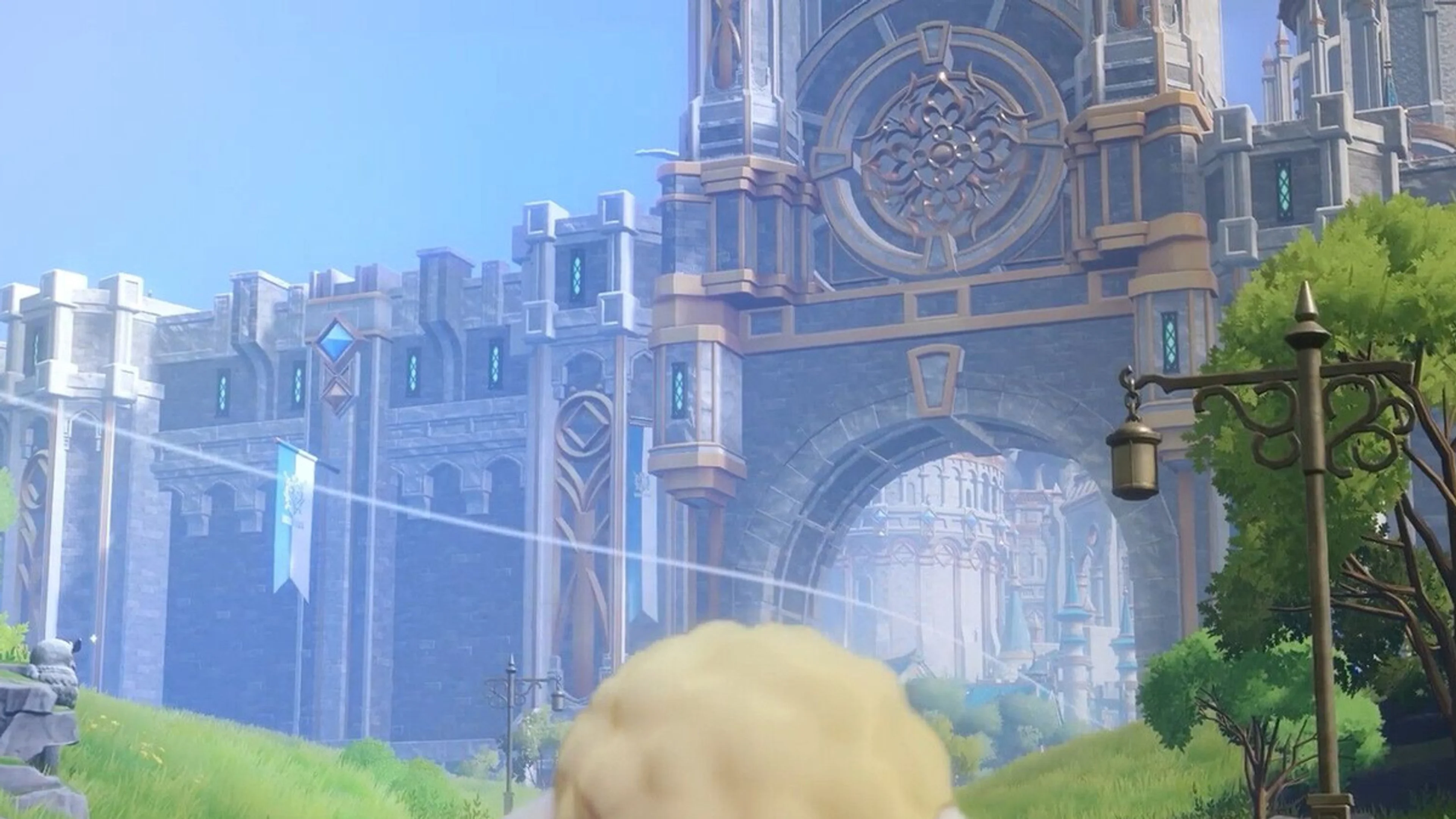 A Wooly walks toward the gates of Rune Factory 6's large new city in clean work-in-progress footage.