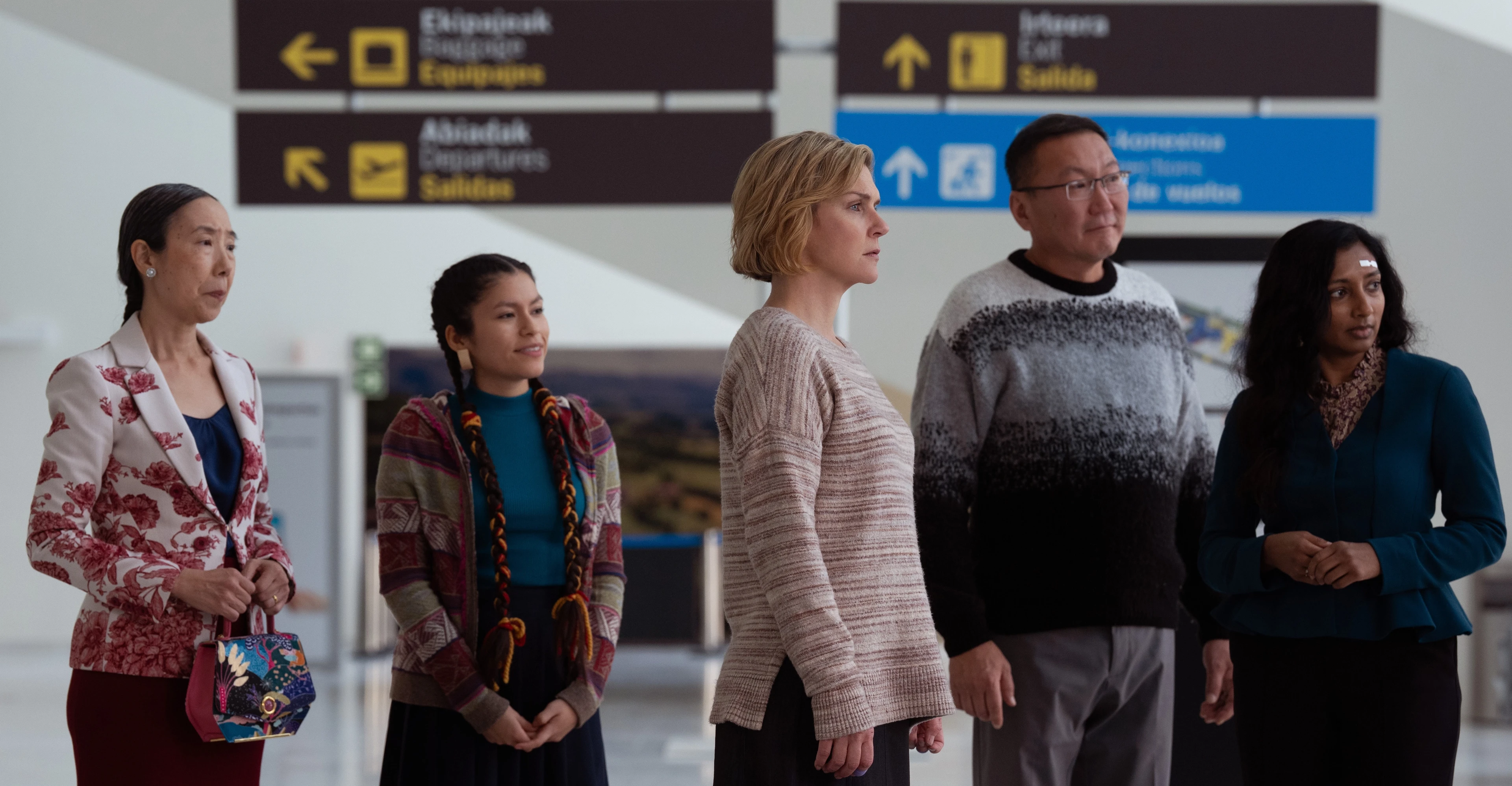 Rhea Seehorn stands with Sharon Gee, Darinka Arones, Amarburen Sanjid and Menik Gooneratne in Pluribus.